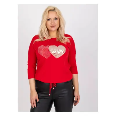 A red blouse of a larger size with a round neckline