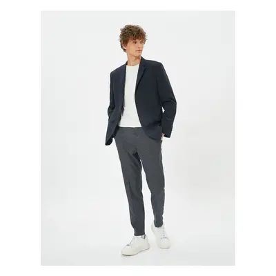 Koton Patterned Woven Trousers with Pockets and Buttons.