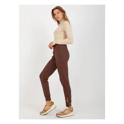 Brown trousers with leg closure by OCH BELLA