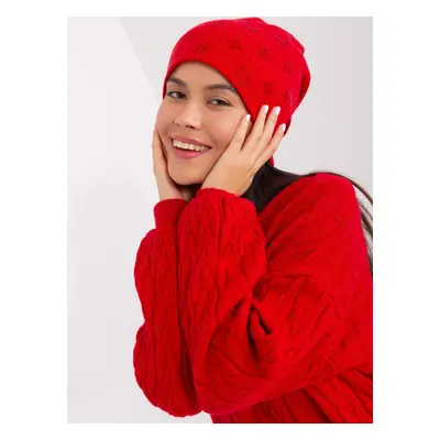 Red winter hat with appliqués