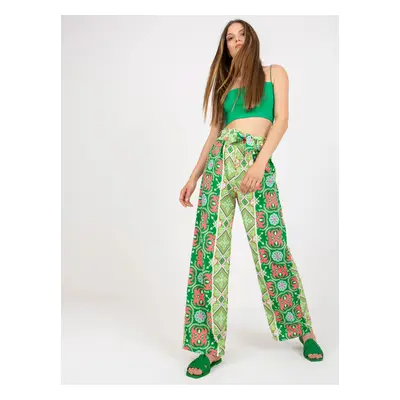 Green patterned fabric trousers with a wide leg