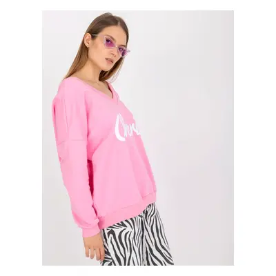 Pink and white sweatshirt with a loose print