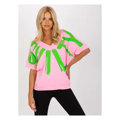 Pink and green blouse with print and neckline on back