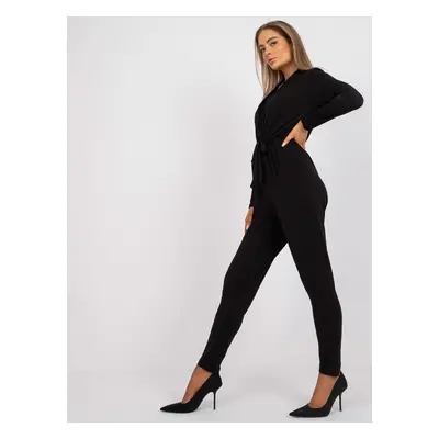 Black monochrome jumpsuit with Serafini belt