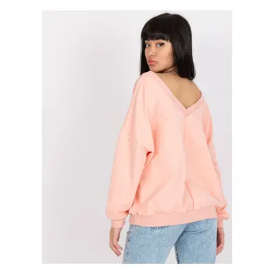 Light pink and black sweatshirt with oversize print