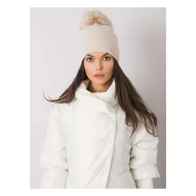 Beige winter hat with pompom