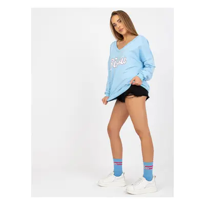 Light blue and white sweatshirt with print and V-neck