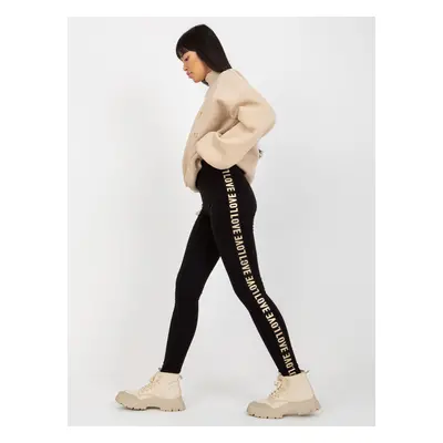 Black casual leggings with inscriptions on the sides