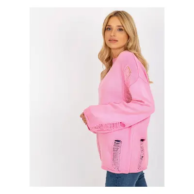 Pink women's oversize sweater with holes