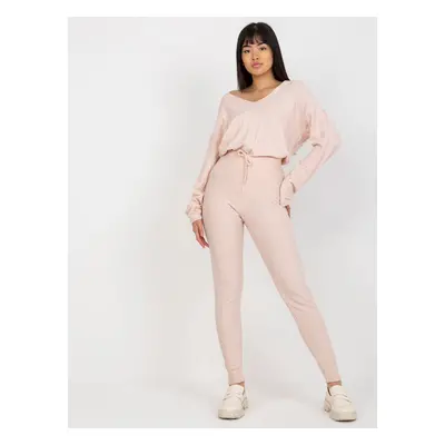 Light pink women's knitted trousers with tie