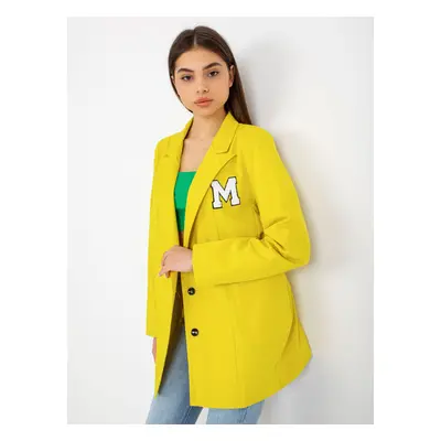 Lady's yellow jacket with patches