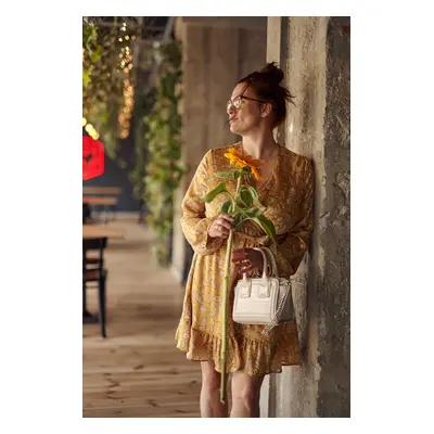 Airy mustard dress with a clutch neckline