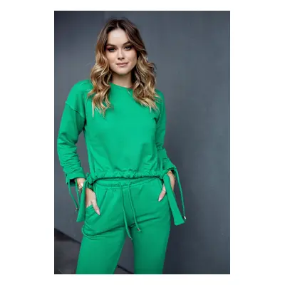 Ordinary women's tracksuit with asymmetrical green sweatshirt