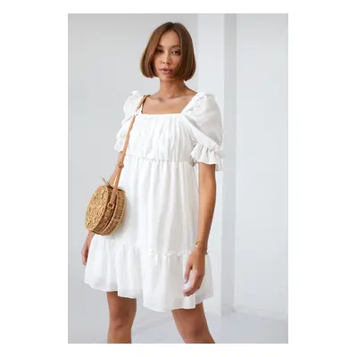 Simple cream dress with ruffles