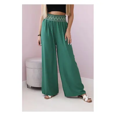 Trousers with a wide elastic waistband in green colour