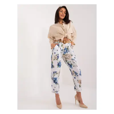 White women's fabric trousers with flowers