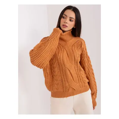 Light brown women's oversize sweater with cables