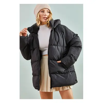 Bianco Lucci Women's Long puffer jacket with a Lace-up hood.