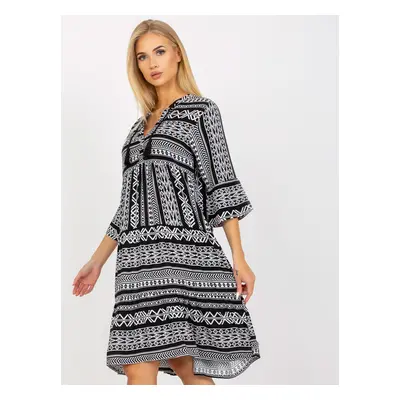 Black patterned dress with ruffle and 3/4 sleeves