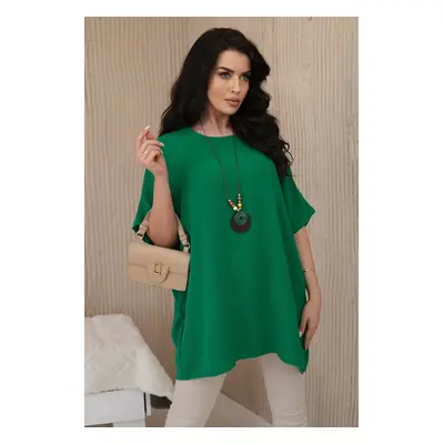 Oversized blouse with a pendant in dark green color