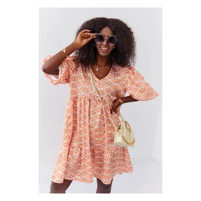 Loose dress with puff sleeves in light orange