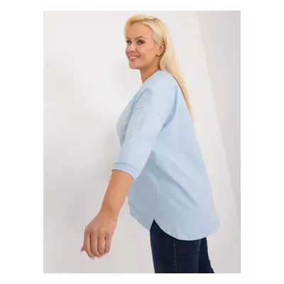 A light blue plus-size blouse with slits