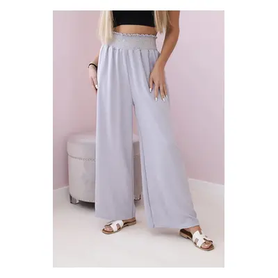 Grey trousers with a wide elastic waistband