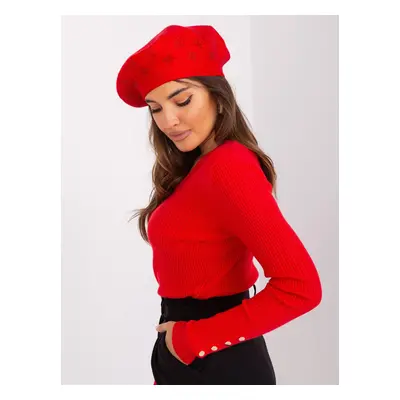 Red women's beret with appliqué