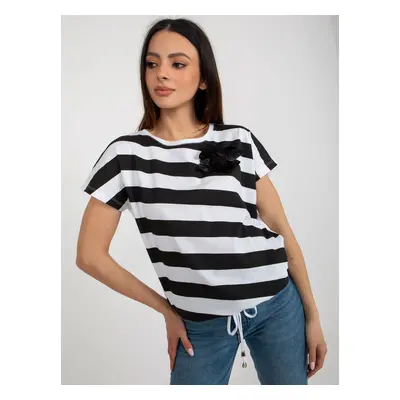 Women's black and white striped blouse with flower