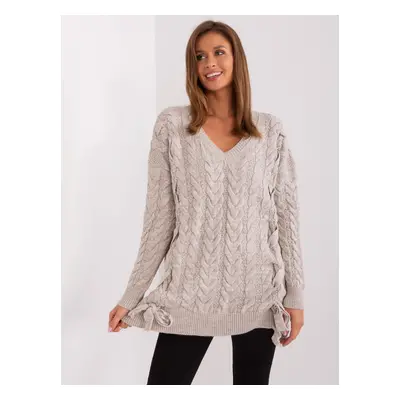 Beige women's sweater with cables