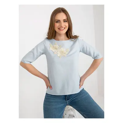 Light blue lady's formal blouse with lace