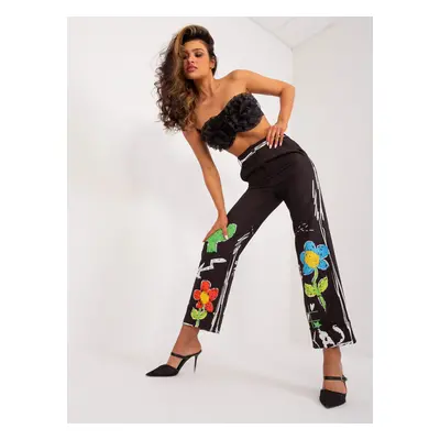 Black wide trousers with print