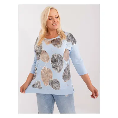 Light blue blouse of a larger size with a print of leaves