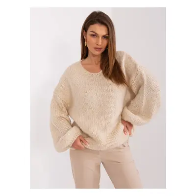 Light beige knitted sweater with wide sleeves