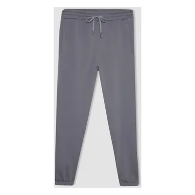 DEFACTO Standard Fit Waist Tie Elastic Leg Pocket Basic Plain Jogger Sweatpants A6468ax24sp