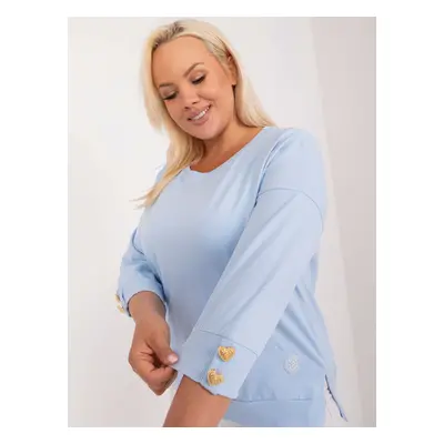 Light blue women's oversized blouse with appliqué