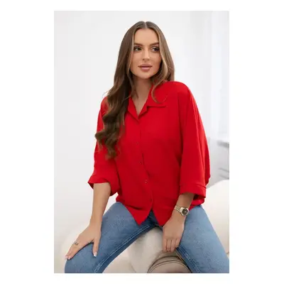 Oversized blouse with red button fastening