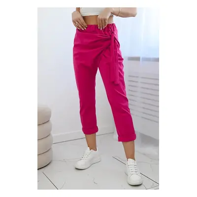 Trousers with asymmetrical fuchsia tie at the front