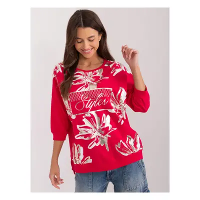 Red women's blouse with a glossy print