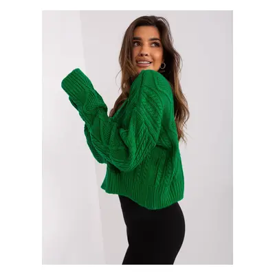 Green loose sweater with cables