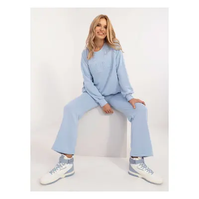 Light blue women's tracksuit with inscription