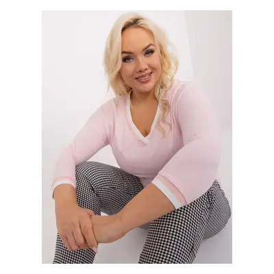 A pale pink solid color blouse in a larger size with cuffs