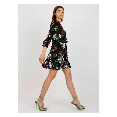 Black flowing floral dress with belt