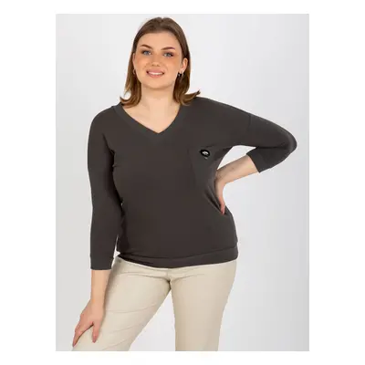 Plain khaki blouse of a larger size with a V-neck