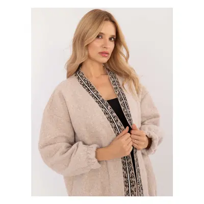 Beige women's cardigan with decorative trim