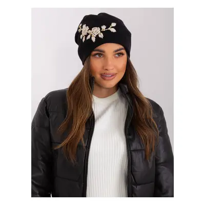 Black and beige knitted beanie with appliqué and rhinestones