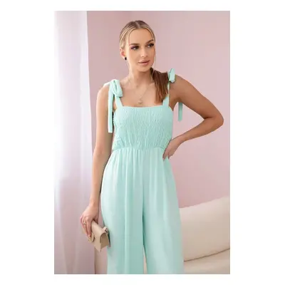 Waisted jumpsuit with a pleated mint top