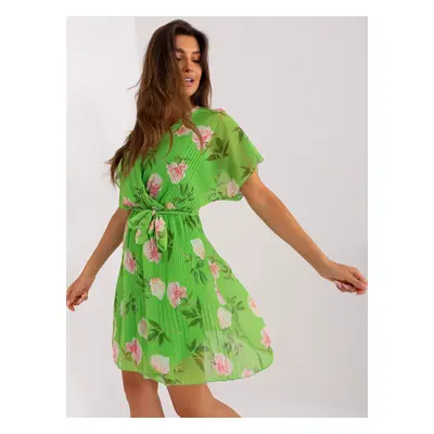 Light green flowing dress with flowers