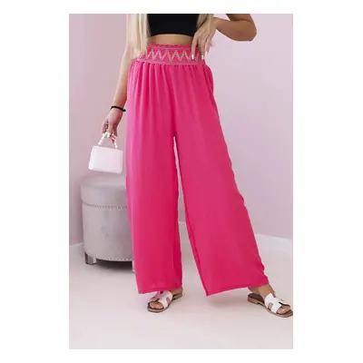 Trousers with a wide elastic waistband in pink color