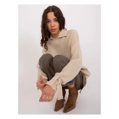 Beige turtleneck with ties on the sleeves